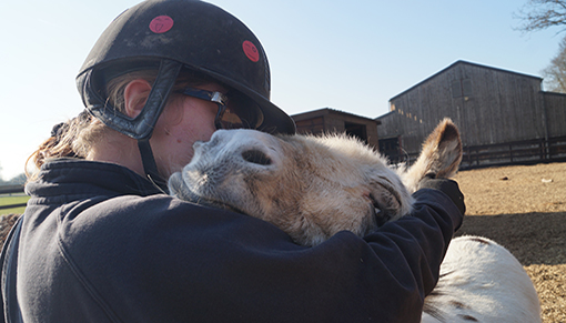 Friendly Dotty adores a cuddle!