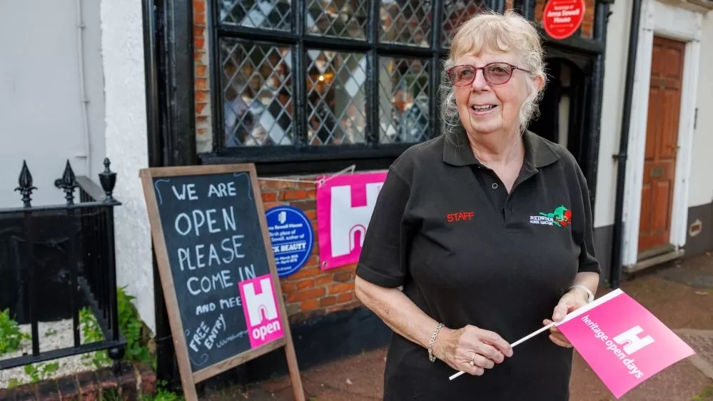 A volunteer welcomes visitors to Anna Sewell House during Heritage Open Days.