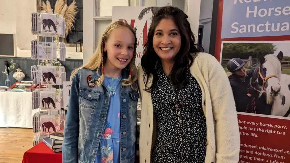 Competition winner Zena poses with head judge and author Sangu Mandanna