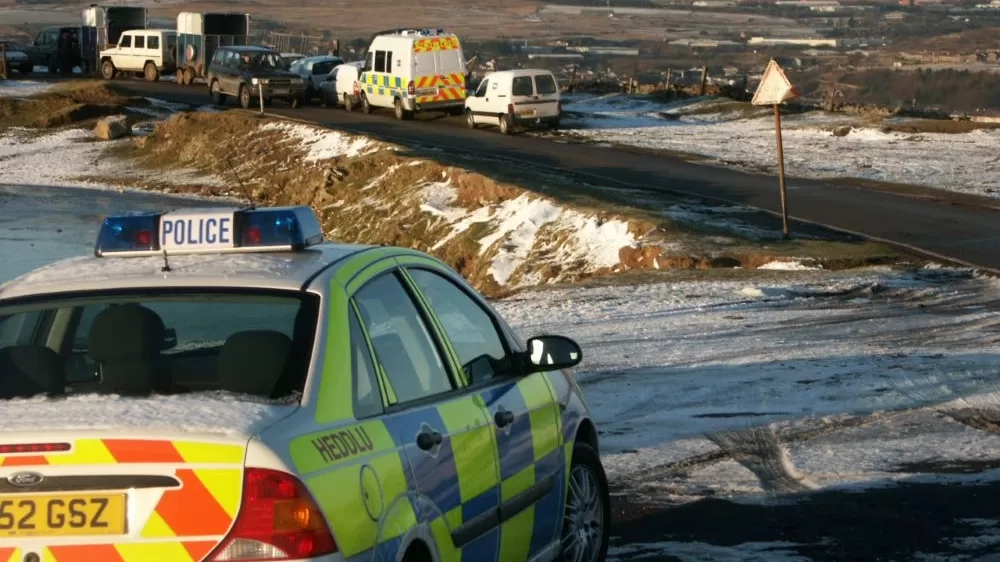 Police vehicles are photographed with rescue cars and horse boxes on Tredegar common