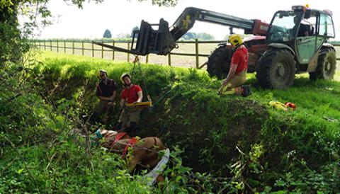 Firefighters practise rescuing their life-sized model horse from a ditch