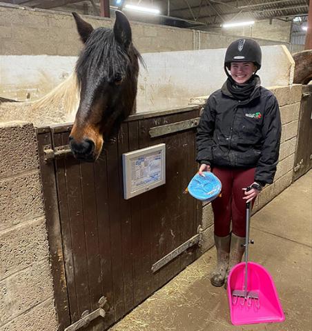 Chloe and Adoption Star Gibson show a poop scoop and treatball kindly bought for Redwings Mountains.