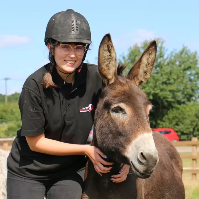 Georgia standing with donkey Wiggins