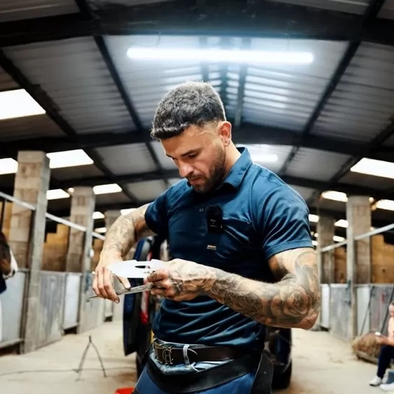 Photo of Sam inside a barn