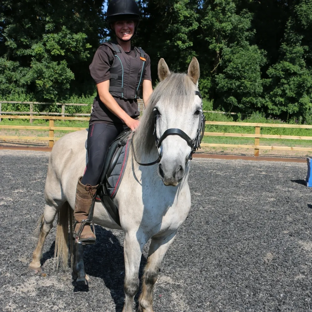 Grey pony and rider