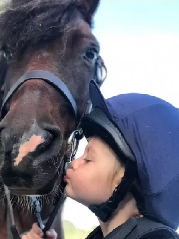 Shaun kissing horse