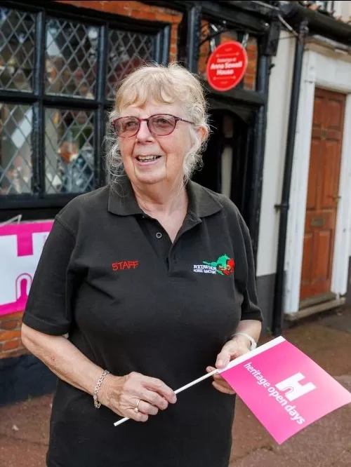 A volunteer welcomes visitors to Anna Sewell House during Heritage Open Days.