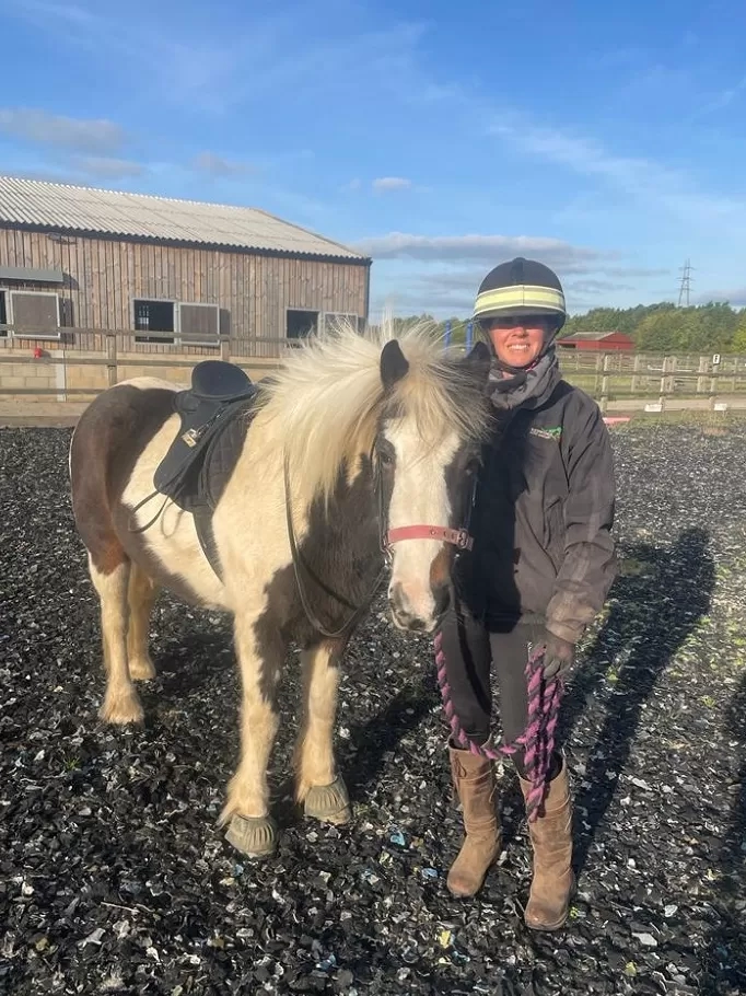 Pony standing with trainer at Redwings